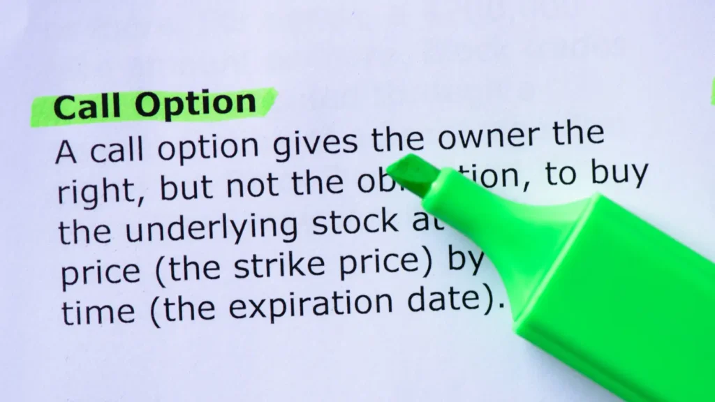 Close-up image of a green highlighter marking the term “Call Option” on a printed definition explaining the right to buy the underlying stock at the strike price before expiration.