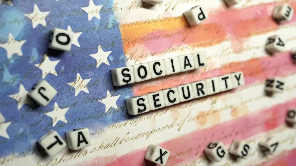Feature image showing the words “Social Security” arranged on letter blocks over a stylized American flag background.